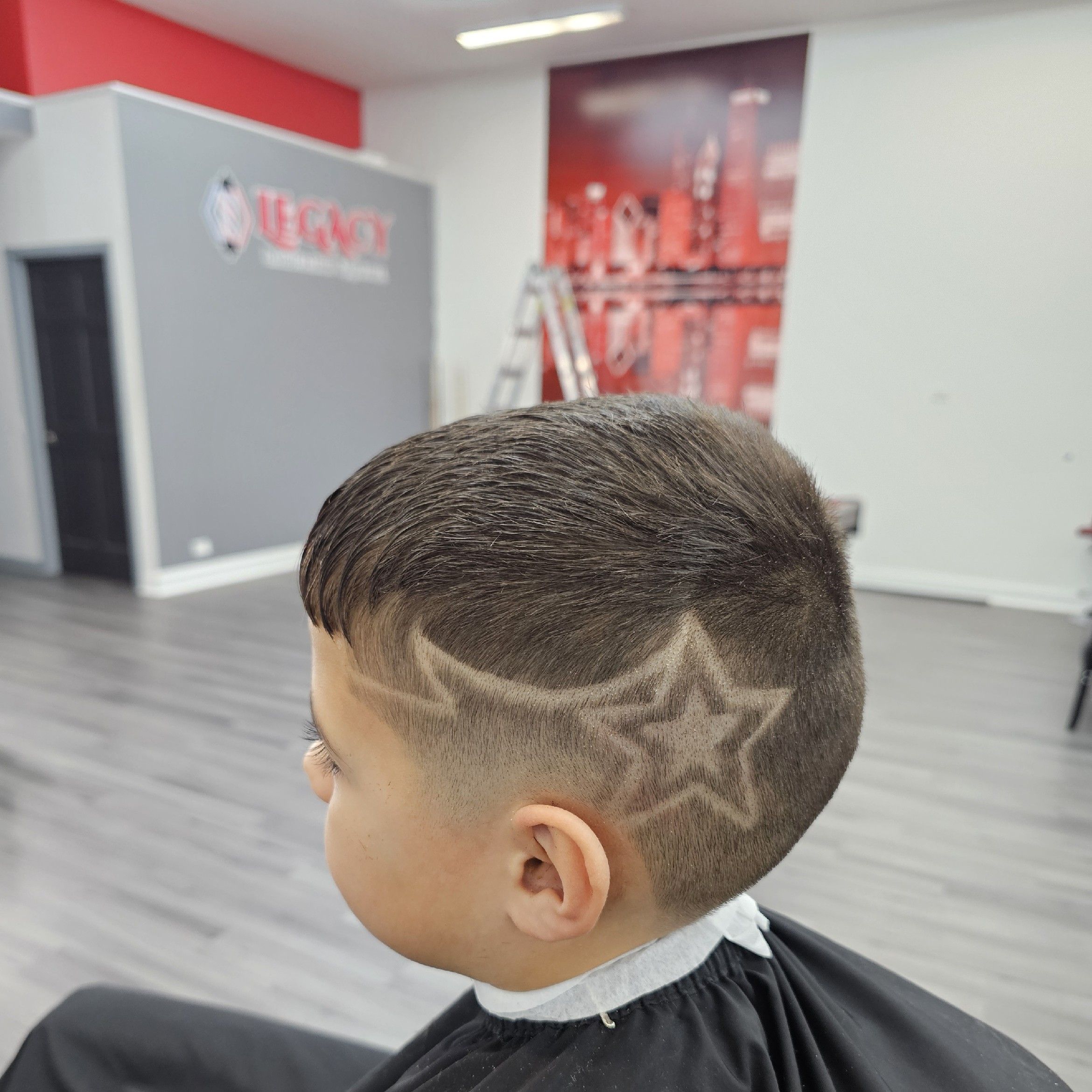 Kids star hair design and fade at Legacy Barbershop & Lounge